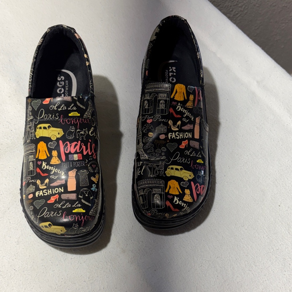 Klogs women’s Black Paris Print Slip-Ons with Yellow and Pink Accents